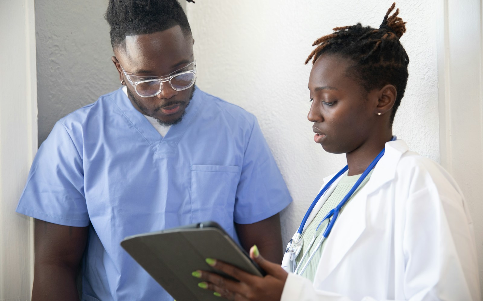 African healthcare professional with patient